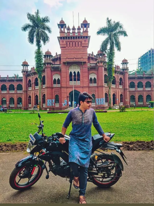 Naim Bin Hasan with his motorbike in front of Curzon Hall, University of Dhaka.