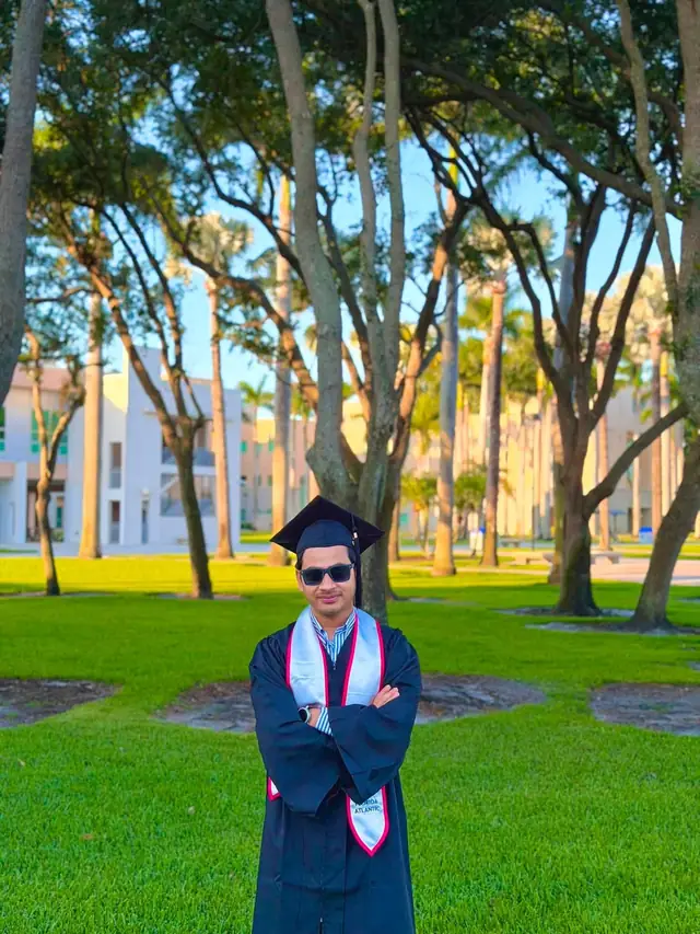 Graduation portrait of Naim Bin Hasan on the Florida Atlantic University campus in Boca Raton, Florida.