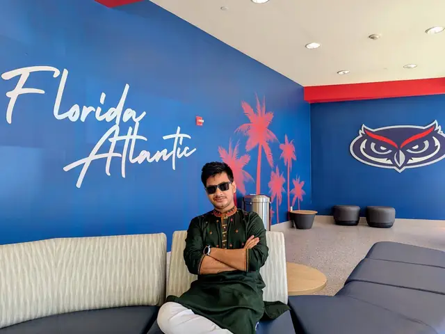 Naim Bin Hasan in a panjabi at the Florida Atlantic University student lounge.
