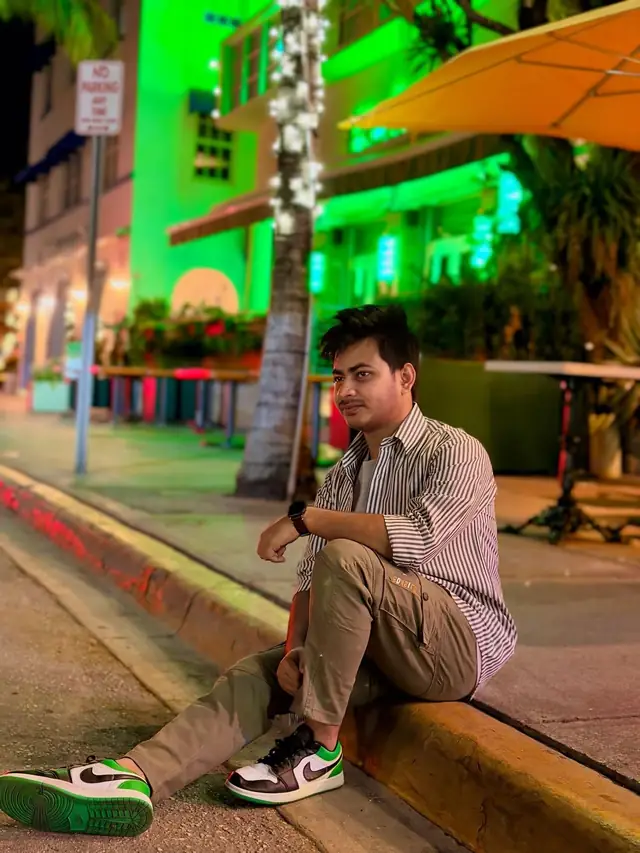 Naim Bin Hasan under the neon of Miami Beach.