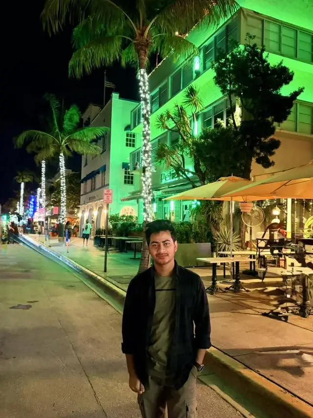Naim Bin Hasan on Ocean Drive, Miami Beach, at night.
